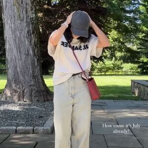 White Graphic T-Shirt with Red Crossbody Bag